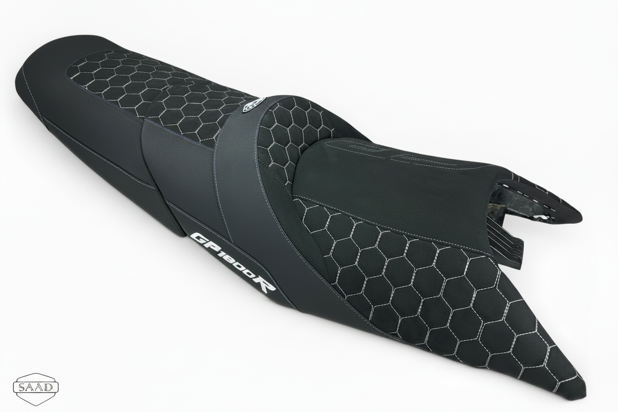 Black motorcycle seat with honeycomb pattern on a white background