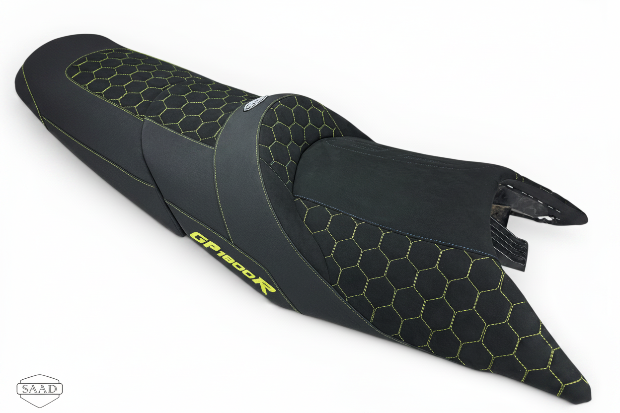 Black motorcycle seat with honeycomb pattern and 'GP 1000' branding on a white background