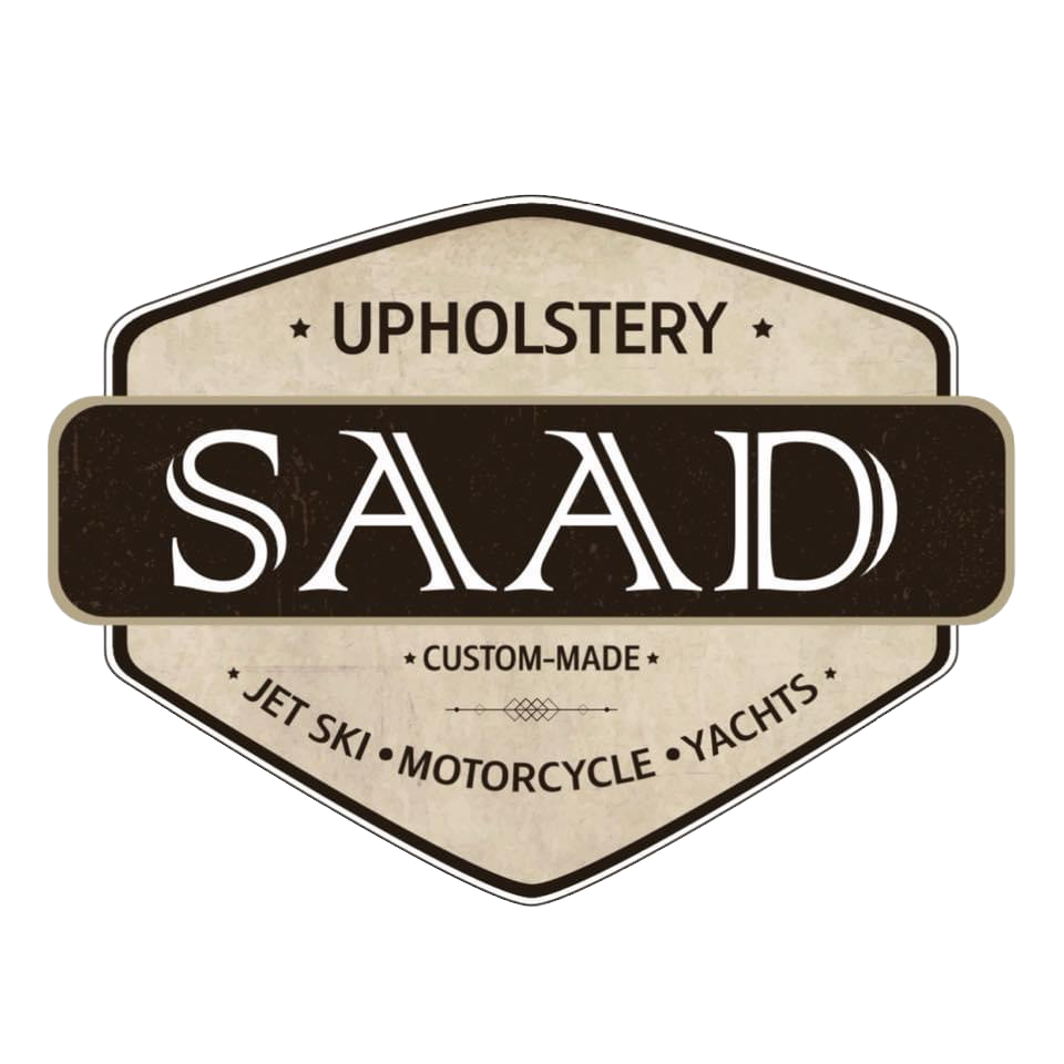 Logo of Saad Upholstery with text about custom-made products for jet ski, motorcycle, and yachts.