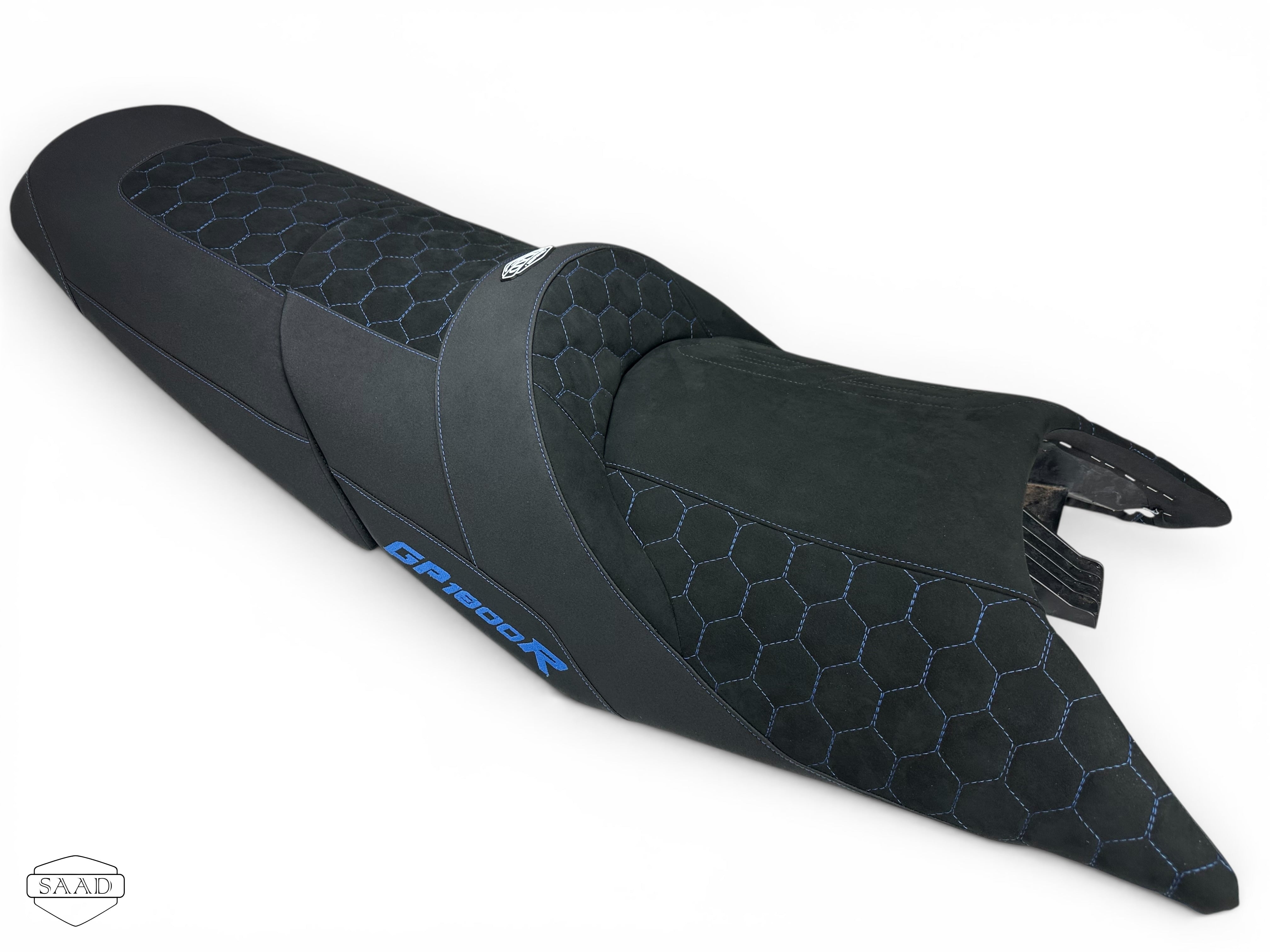 Black motorcycle seat with honeycomb pattern on a white background